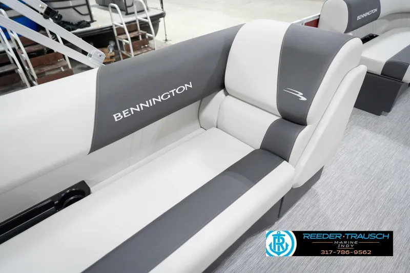 Slide: The Image of 2026 Bennington 20 SL boat interior with gray and white seating, Reeder-Trausch Marine logo. - 44