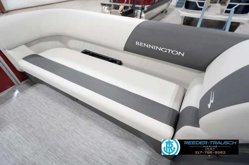 Slide: The Image of 2026 Bennington 20 SL boat interior with gray and white seating, Reeder-Trausch Marine logo. - 45