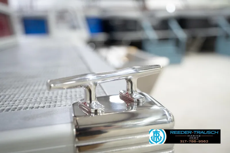 Slide: The Image of 2026 Bennington 20 SL boat cleat detail, Reeder-Trausch Marine logo visible. - 54