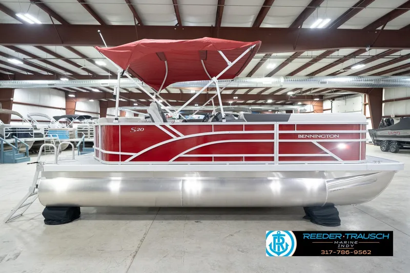 Slide: The Image of 2026 Bennington 20 SL pontoon boat with red canopy in showroom. - 7