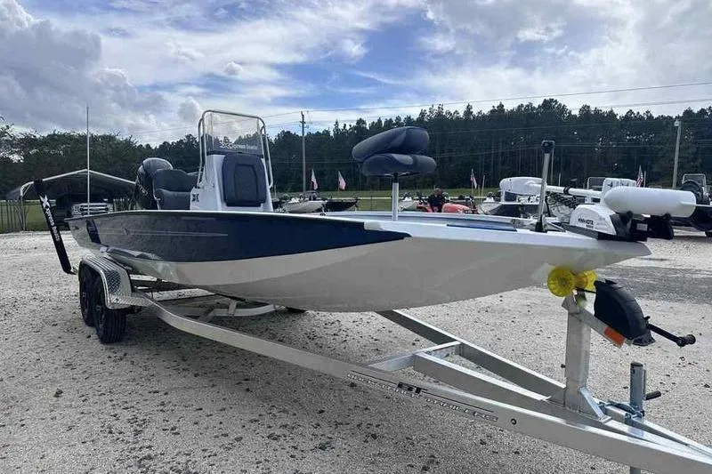 Slide: The Image of 2026 Xpress H22 boat on trailer, parked outdoors under cloudy sky. - 4