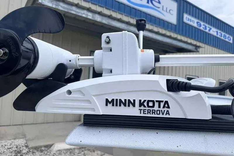 Slide: The Image of Minn Kota Terrova motor on Xpress H22, 2026 model, outside a building. - 5