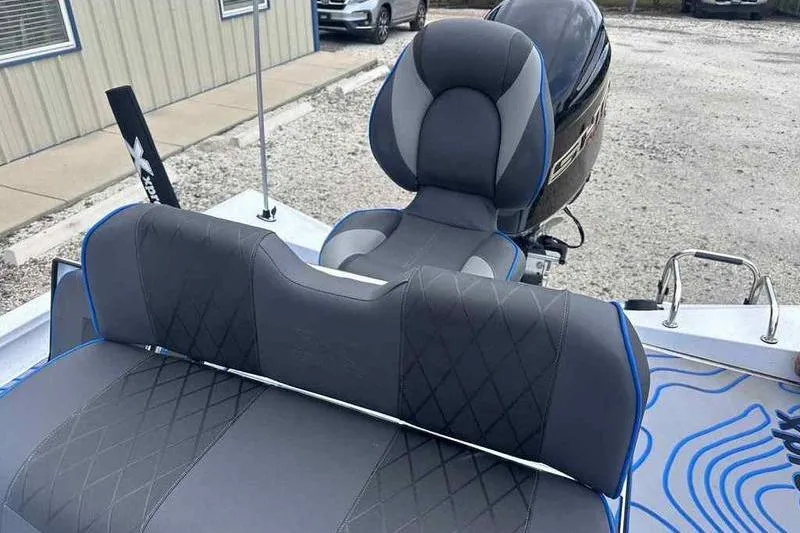 Slide: The Image of 2026 Xpress H22 boat interior with cushioned seating and modern design. - 7