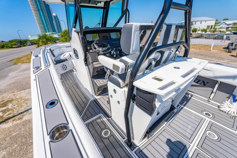 Slide: The Image of 2021 Blackfin 272 CC boat interior with modern helm and seating. - 14
