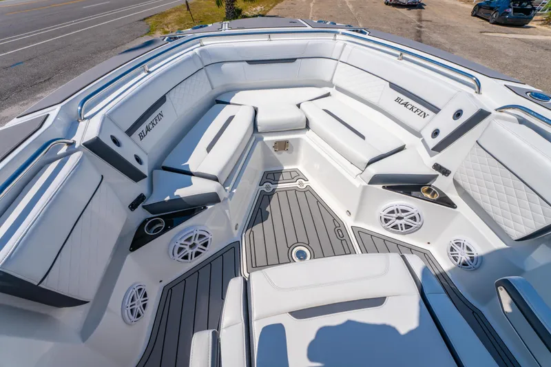 Slide: The Image of Luxurious 2021 Blackfin 272 CC boat interior with white seating and modern design. - 25