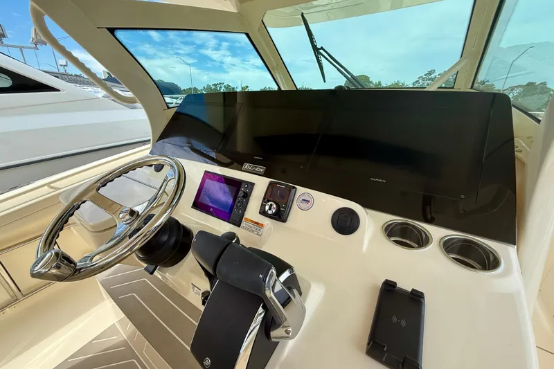 Slide: The Image of 2026 Scout 400 LXF Li-Ion boat interior with stainless steel fixtures and seating. - 13