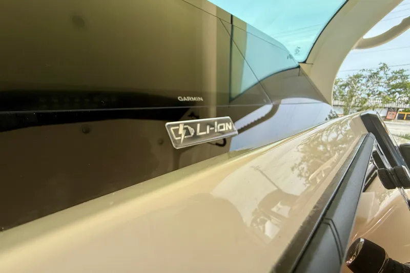 Slide: The Image of 2026 Scout 400 LXF Li-Ion boat interior with luxurious beige seating and elegant design. - 16