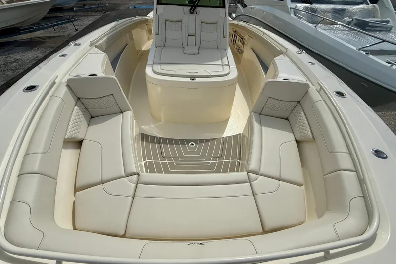 Slide: The Image of Luxurious seating on 2026 Scout 400 LXF Li-Ion boat under clear blue sky. - 23