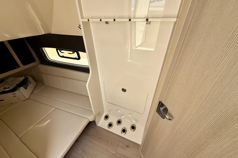 Slide: The Image of 2026 Scout 400 LXF Li-Ion boat interior with luxurious seating and storage compartments. - 28