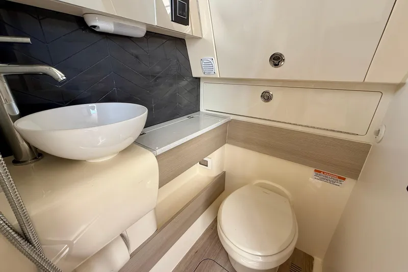 Slide: The Image of Interior of 2026 Scout 400 LXF Li-Ion boat, featuring seating and storage. - 32