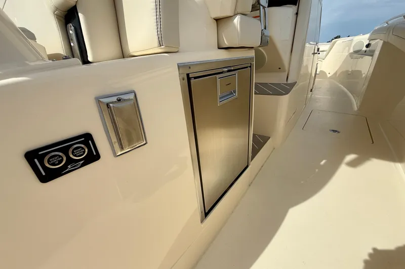 Slide: The Image of 2026 Scout 400 LXF Li-Ion boat with four Mercury outboard engines, rear seating, and storage compartments. - 9