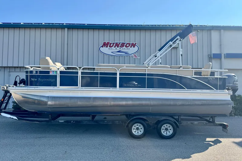 Slide: The Image of 2015 Bennington 24 SFX pontoon boat on trailer at Munson Ski & Marine. - 1