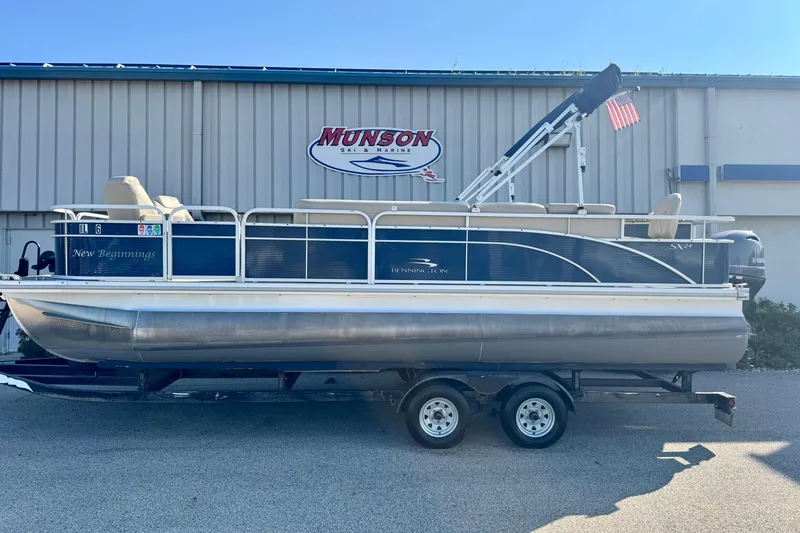 Slide: The Image of 2015 Bennington 24 SFX pontoon boat on trailer at Munson Ski & Marine. - 2