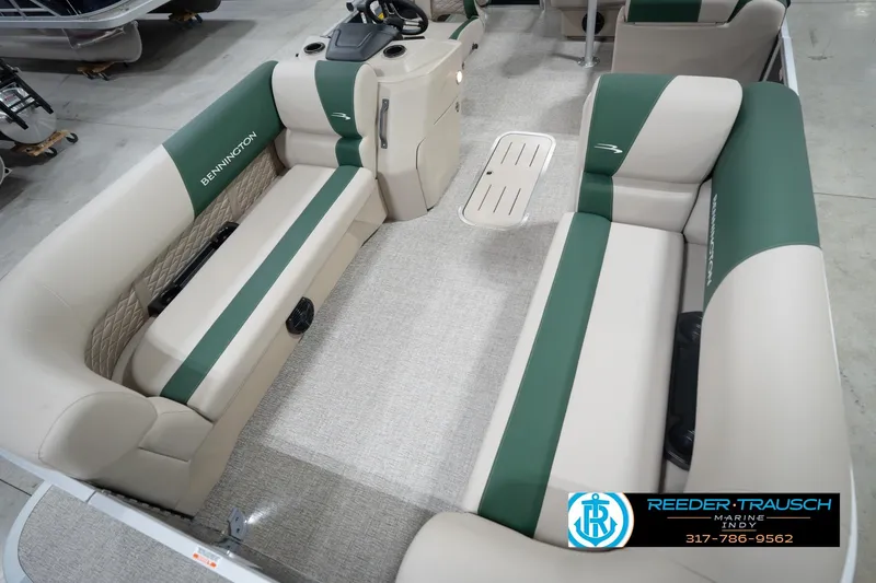 Slide: The Image of 2026 Bennington 20 SLJ pontoon boat interior with green and beige seating. - 12