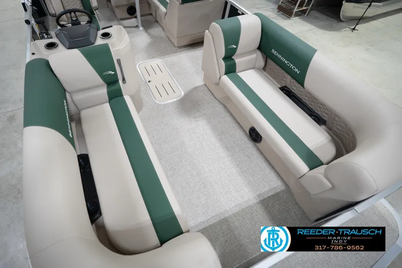Slide: The Image of 2026 Bennington 20 SLJ pontoon boat interior with green and beige seating. - 13