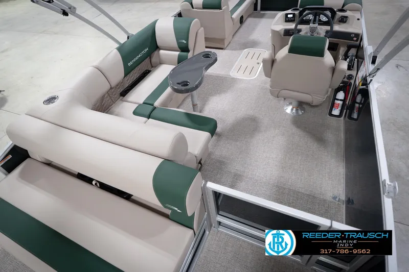 Slide: The Image of 2026 Bennington 20 SLJ pontoon boat interior with plush seating and modern helm. - 14