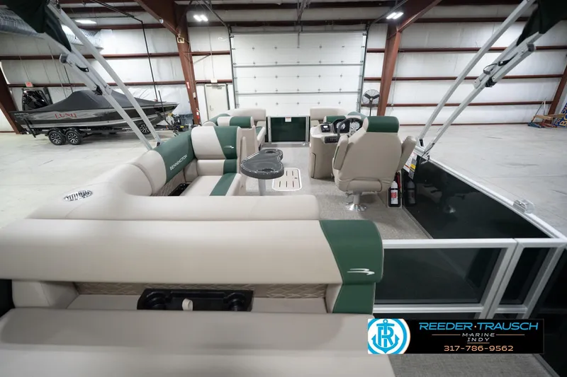 Slide: The Image of 2026 Bennington 20 SLJ pontoon boat interior in a spacious showroom. - 19