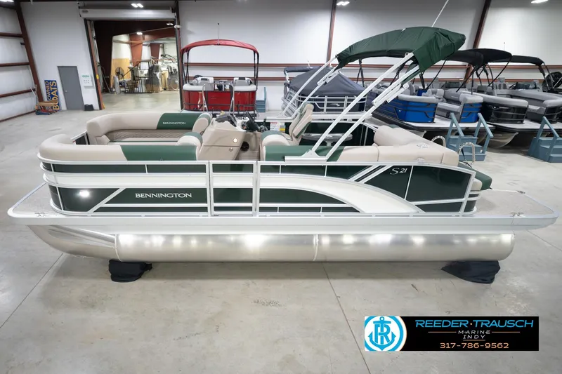 The Image of 2026 Bennington 20 SLJ pontoon boat in showroom, green and beige design, side view. - 2