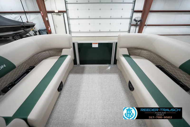 Slide: The Image of Interior of 2026 Bennington 20 SLJ pontoon boat with beige and green seating. - 21