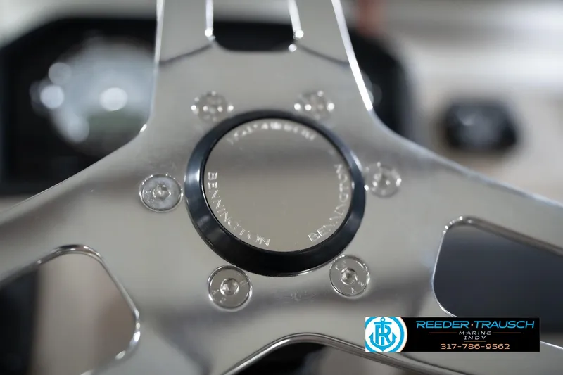 Slide: The Image of Steering wheel of 2026 Bennington 20 SLJ boat, featuring sleek metallic design. - 33
