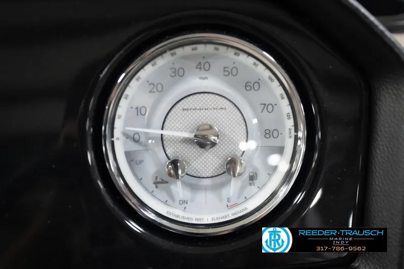 Slide: The Image of Close-up of 2026 Bennington 20 SLJ speedometer, displaying mph and km/h, with Reeder Trausch logo. - 37