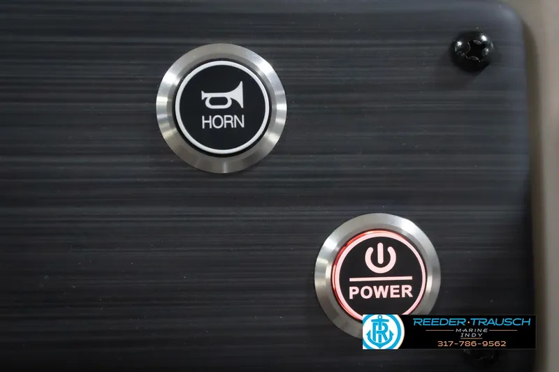 Slide: The Image of Buttons for horn and power on a 2026 Bennington 20 SLJ boat dashboard. - 39