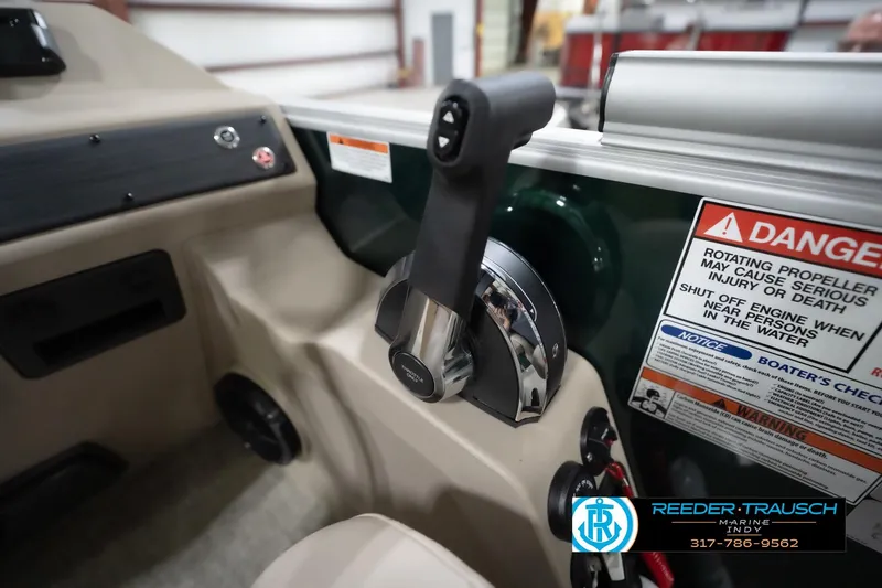 Slide: The Image of Control panel of 2026 Bennington 20 SLJ boat with safety warnings and throttle lever. - 40