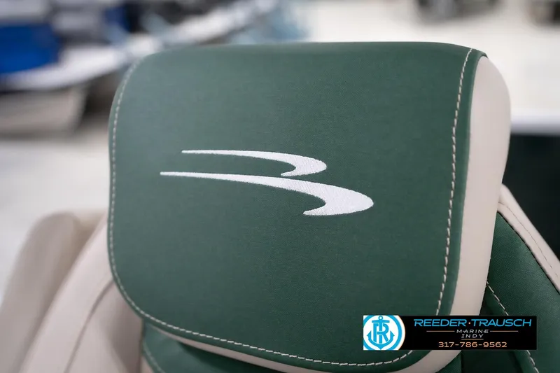 Slide: The Image of Green Bennington 20 SLJ 2026 boat seat with logo, Reeder-Trausch Marine branding. - 42