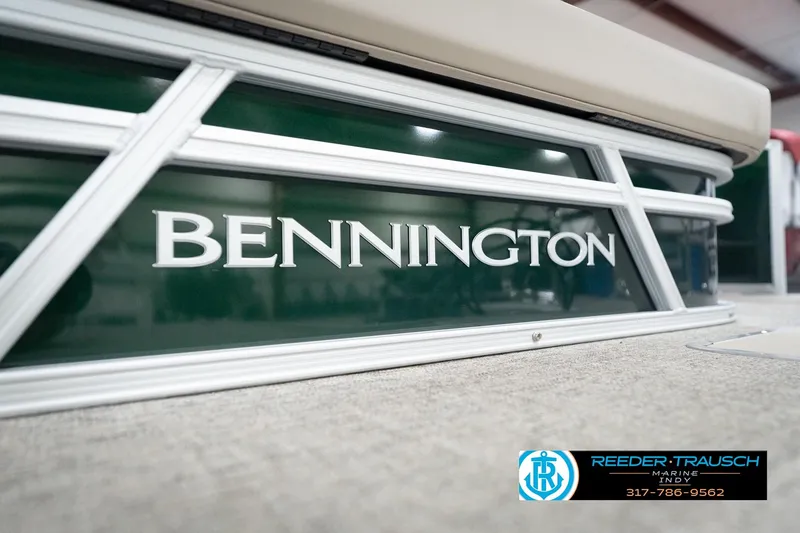 Slide: The Image of 2026 Bennington 20 SLJ pontoon boat with green paneling and white logo. - 52