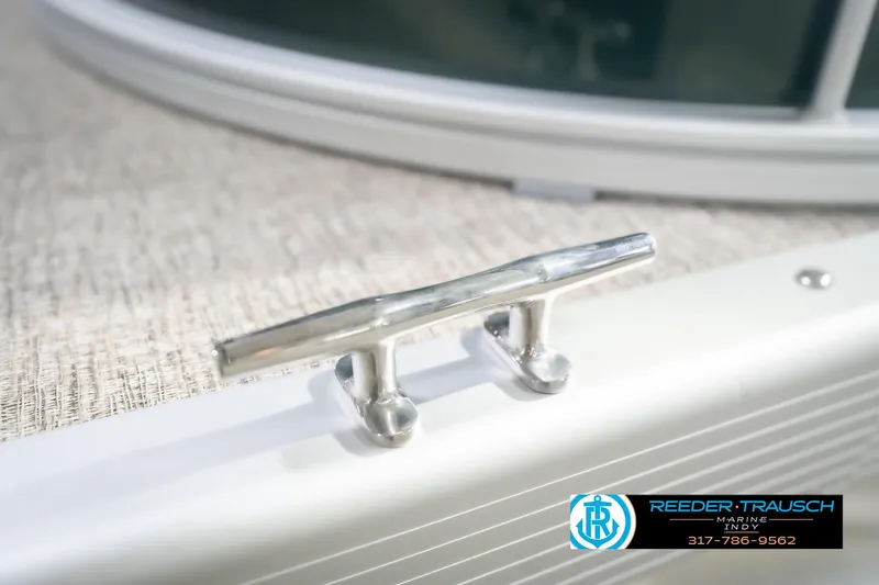 Slide: The Image of 2026 Bennington 20 SLJ boat cleat detail with Reeder-Trausch Marine logo. - 55