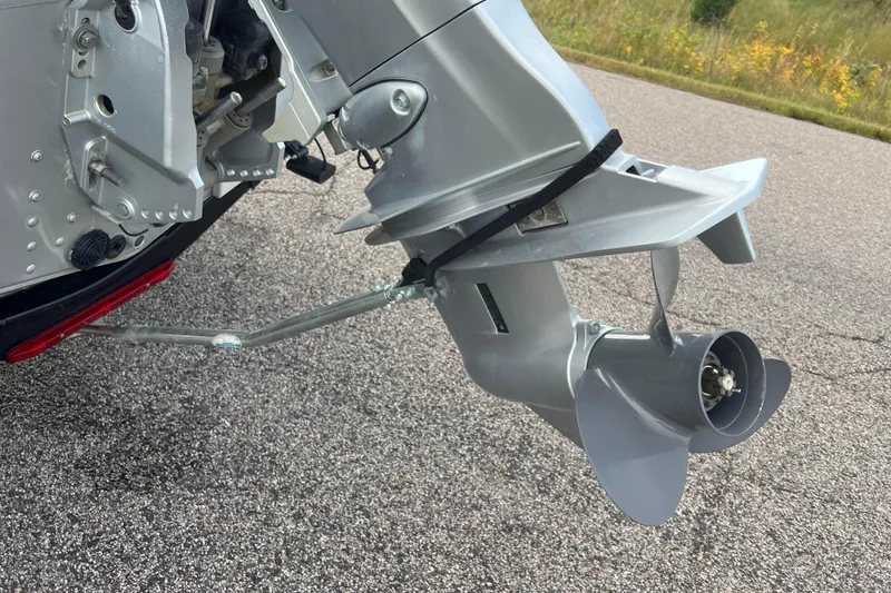 Slide: The Image of Outboard motor of 2023 Alumacraft Voyageur 175 SC on a paved road. - 12