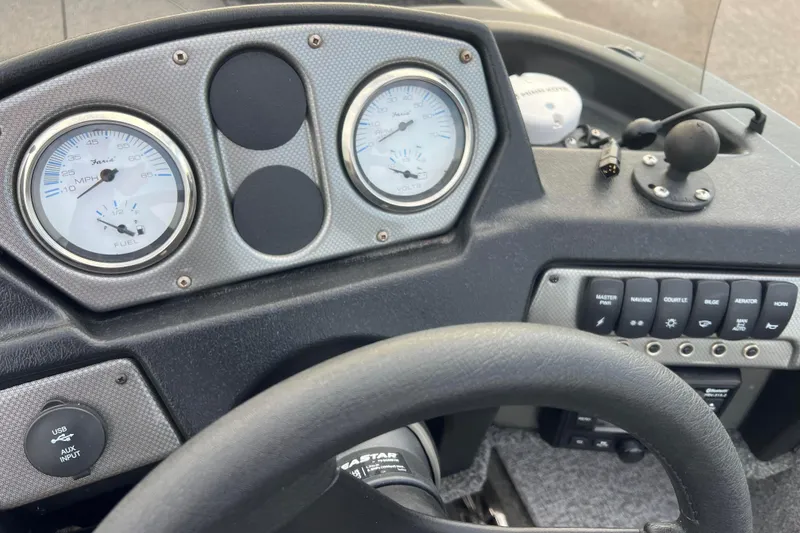 Slide: The Image of 2023 Alumacraft Voyageur 175 SC dashboard with gauges and control panel. - 15