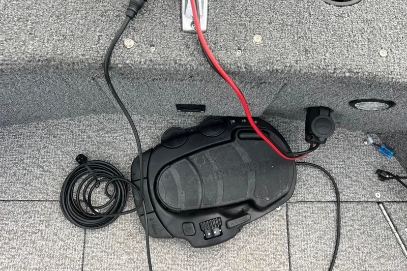 Slide: The Image of 2023 Alumacraft Voyageur 175 SC boat interior with Minn Kota foot pedal and wiring. - 36