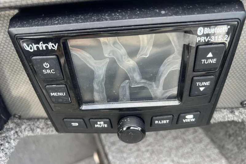 Slide: The Image of Infinity Bluetooth stereo system on 2023 Alumacraft Voyageur 175 SC boat dashboard. - 39