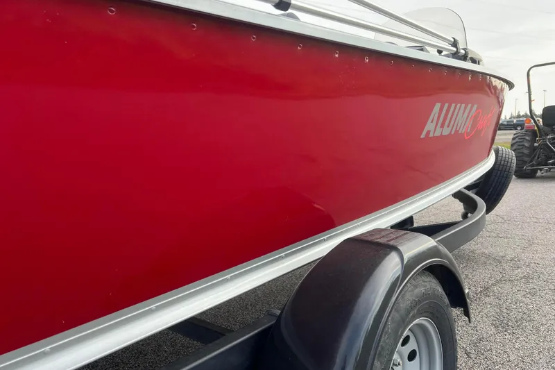 Slide: The Image of 2023 Alumacraft Voyageur 175 SC boat in vibrant red on a trailer. - 43