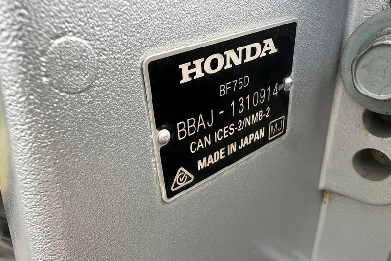 Slide: The Image of Honda BF75D engine label on 2023 Alumacraft Voyageur 175 SC, made in Japan. - 6