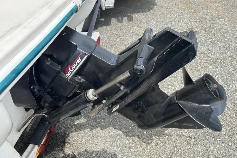 Slide: The Image of 1998 Sea Ray 180 Bow Rider with MerCruiser outboard motor on pavement. - 2