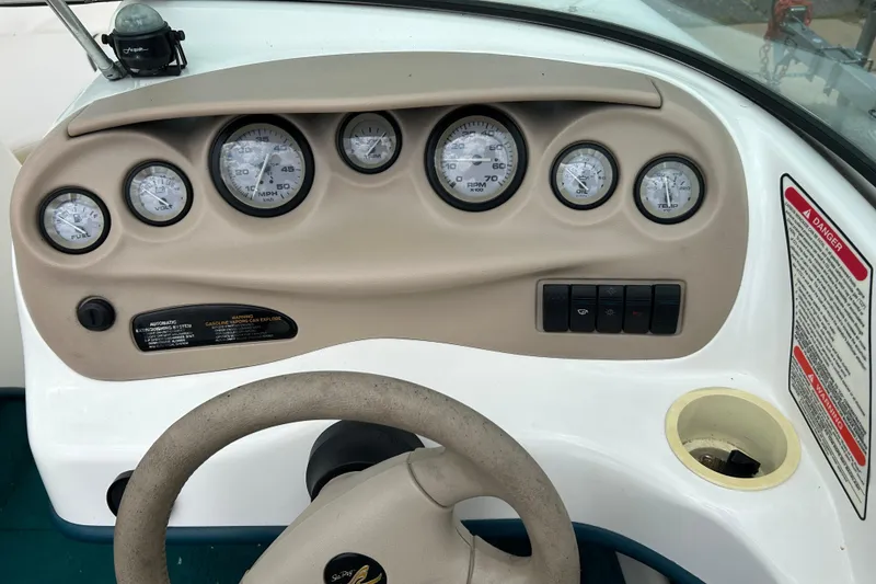 Slide: The Image of Dashboard of a 1998 Sea Ray 180 Bow Rider boat with gauges and controls. - 5