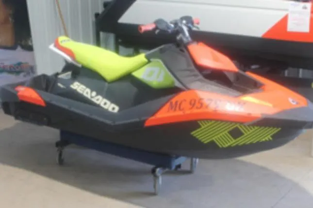 Slide: The Image of 2020 Sea-Doo Spark Trixx 2-up jet ski with vibrant orange and green design. - 1