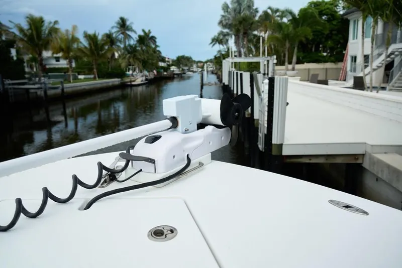 Slide: The Image of 2024 Onslow Bay 33 Tournament boat docked in a scenic canal setting. - 10