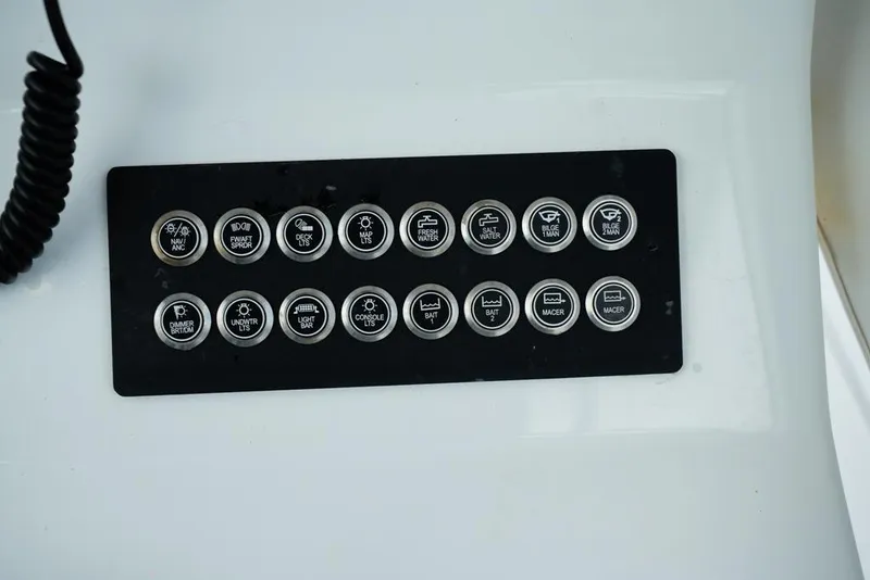 Slide: The Image of Control panel of 2024 Onslow Bay 33 Tournament boat with labeled buttons. - 14