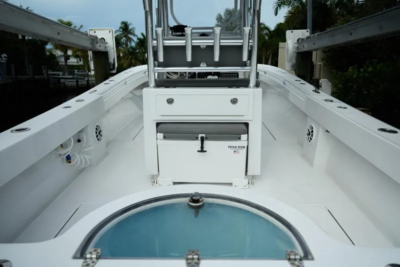Slide: The Image of 2024 Onslow Bay 33 Tournament boat interior with fishing equipment and storage. - 18