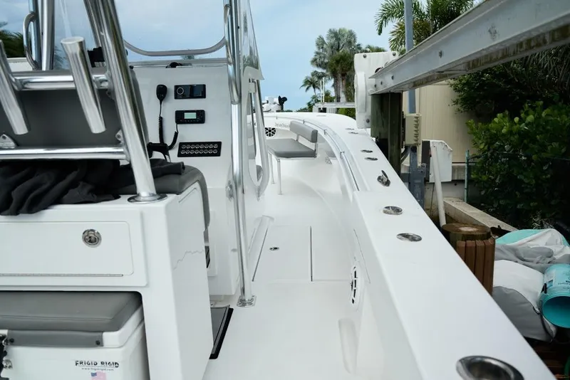 Slide: The Image of 2024 Onslow Bay 33 Tournament boat interior with control panel and seating area. - 9