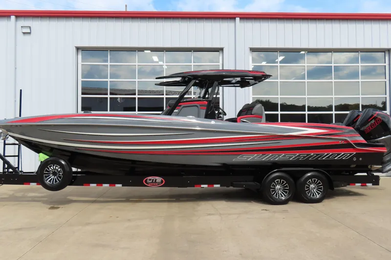 The Image of 2025 Sunsation 32CCX powerboat with sleek design, parked on a trailer. - 0