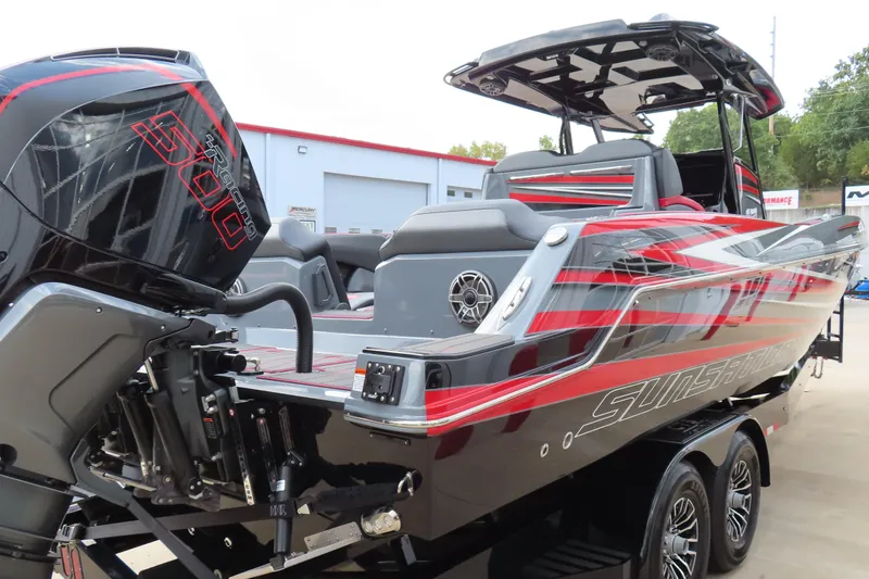 Slide: The Image of 2025 Sunsation 32CCX powerboat with bold red and black design, featuring a powerful outboard engine. - 10