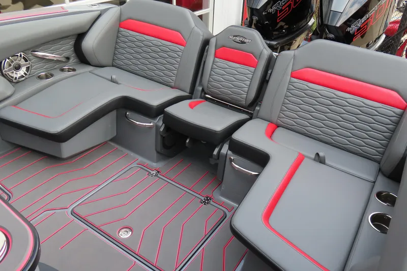 Slide: The Image of Luxurious seating in 2025 Sunsation 32CCX boat with red accents and cup holders. - 14