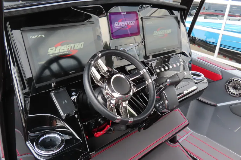 Slide: The Image of Cockpit of 2025 Sunsation 32CCX powerboat with advanced Garmin navigation displays. - 15