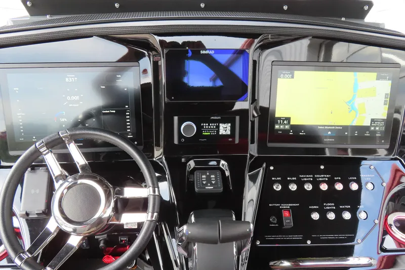 Slide: The Image of Dashboard of 2025 Sunsation 32CCX boat with advanced navigation and control systems. - 16