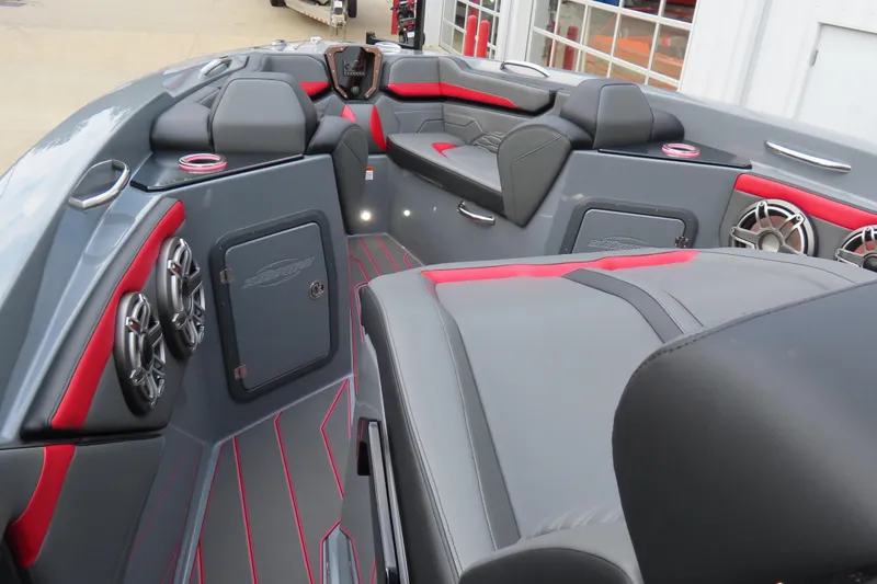 Slide: The Image of 2025 Sunsation 32CCX boat interior with sleek gray and red design, featuring premium seating and speakers. - 17