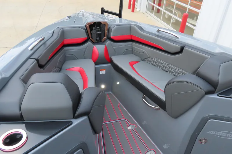 Slide: The Image of 2025 Sunsation 32CCX boat interior with sleek gray and red seating design. - 19